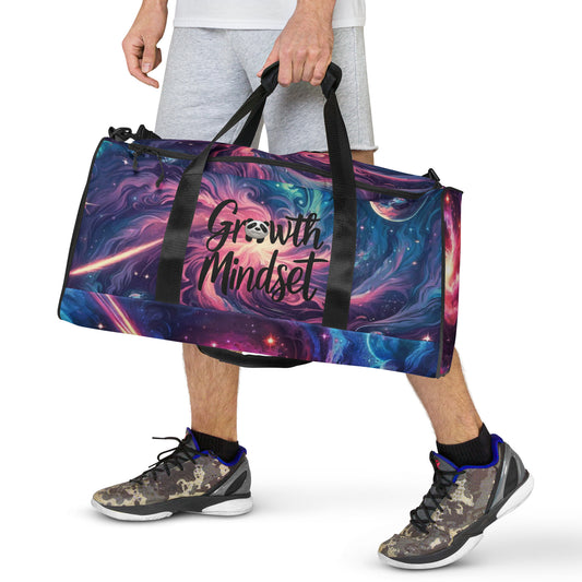 Person Holding a "Growth Mindset" Duffle Bag with Colorful Abstract Galaxy Design – Ideal Gym Bag for Fitness Enthusiasts Featuring Inspirational Quotes and Unique Artistic Graphics for Motivation and Style