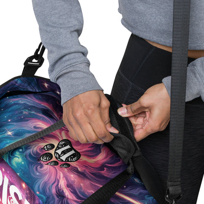 Close-Up of a Person Adjusting the Strap on a "Growth Mindset" Duffle Bag with Colorful Galaxy Design – Ideal Gym Bag for Fitness Enthusiasts Featuring Inspirational Quotes, Stylish Graphics, and Adjustable Straps for Comfort and Convenience