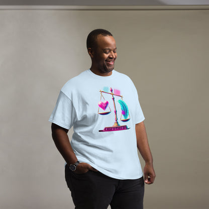 Stylish Black Man Wearing a Light Blue T-Shirt with a Design Depicting a Heart and Feather on a Scale, Symbolizing Ma'at – Showcasing Trendy Urban Fashion for Men with Symbolic Art Representing the Balance of Truth and Justice, Captured in a Studio Setting