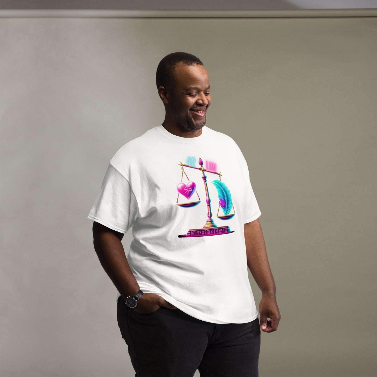 Fashionable Black Man Wearing a White T-Shirt with a Heart and Feather Scale Design, Representing Ma'at – Showcasing Unique Urban Fashion for Men with Symbolic Art Highlighting Balance and Justice, Captured in a Studio Setting