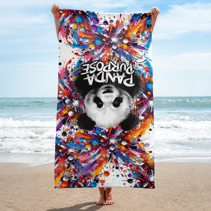 Person Holding a Vibrantly Colored Beach Towel with a Panda Design and the Text "Panda Purpose" – Showcasing Artistic and Inspirational Beach Accessories with Bold and Creative Graphics, Captured on a Sunny Beachfront